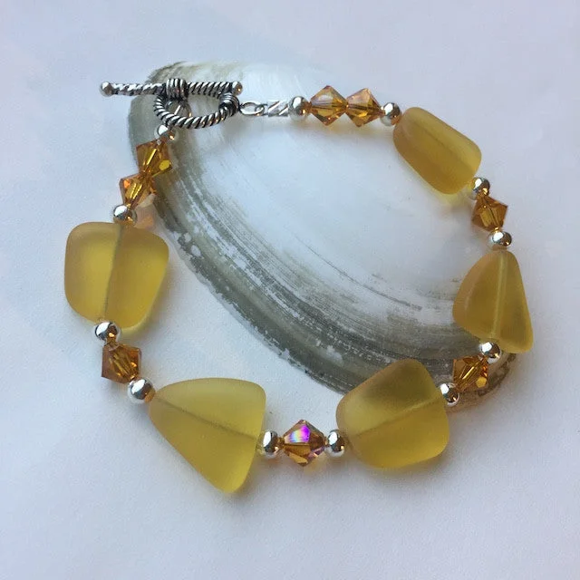 Amber-colored sea glass bracelet with Swarovski crystals and sterling silver