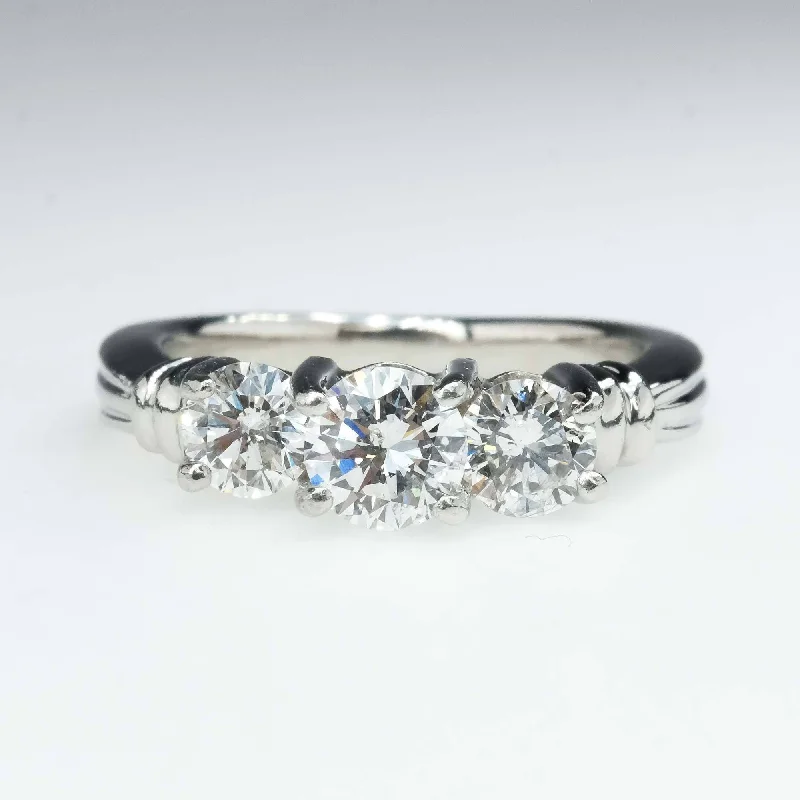 Platinum 1.00ctw Round Diamond SI2/H Three Stone Engagement Ring Size 4.75